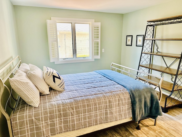 bedroom featuring wood finished floors