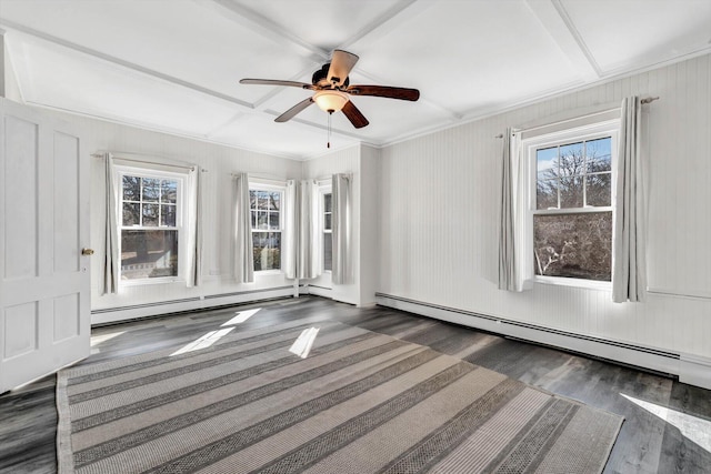 spare room featuring plenty of natural light, ornamental molding, and a baseboard radiator