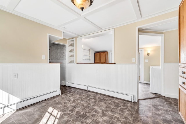 spare room with a wainscoted wall, a baseboard radiator, washer / clothes dryer, and coffered ceiling