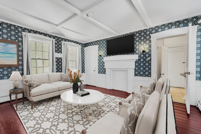 living room featuring wallpapered walls, coffered ceiling, a wainscoted wall, and wood finished floors