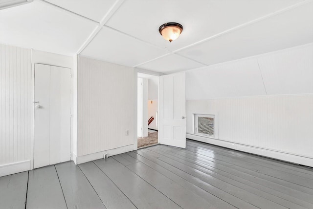 spare room with visible vents and wood finished floors