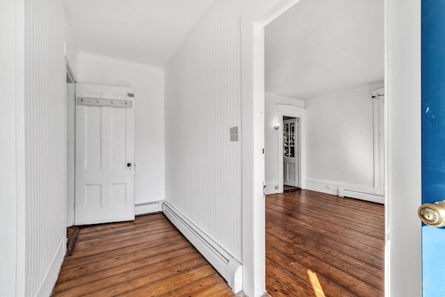 hallway with baseboard heating and dark wood-style flooring