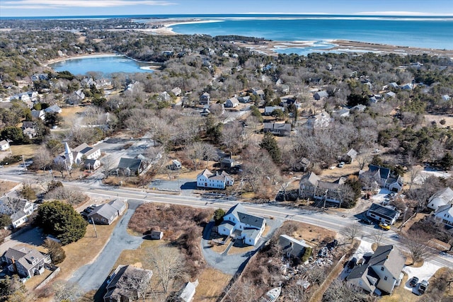 drone / aerial view featuring a water view and a residential view