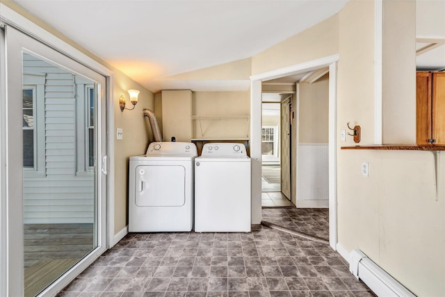 laundry room with a baseboard heating unit, laundry area, and washer and clothes dryer