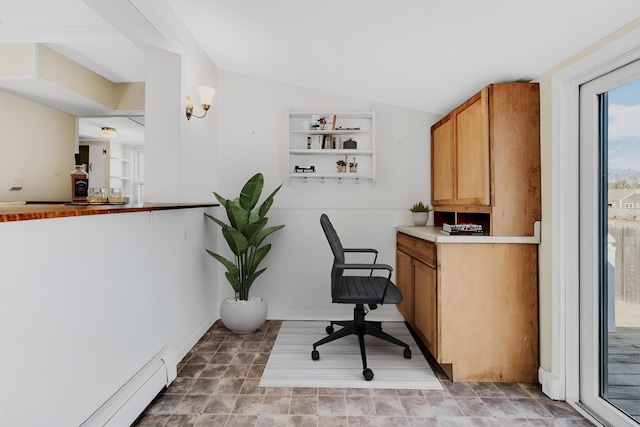 office featuring lofted ceiling and baseboard heating