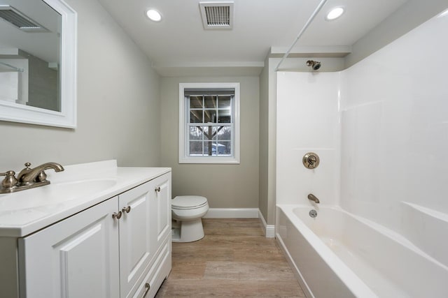 full bathroom featuring vanity, toilet, shower / bathing tub combination, and wood-type flooring