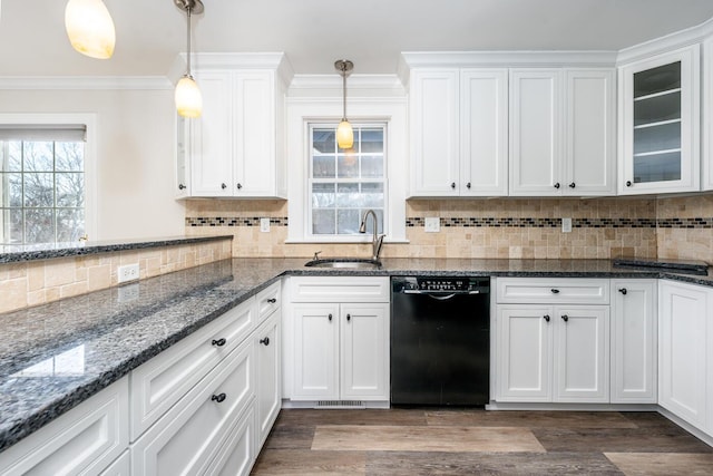 kitchen with sink, dishwasher, white cabinets, and decorative light fixtures