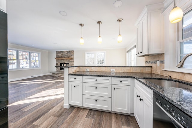 kitchen featuring sink, white cabinets, and black dishwasher