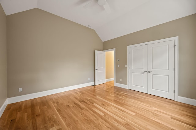 7 Nicklaus Way, Mashpee, MA 02649 - unfurnished bedroom with vaulted ceiling, light wood-type flooring, a closet, and baseboards