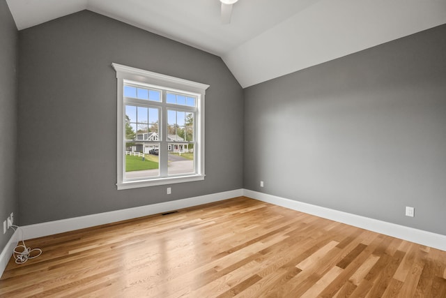 7 Nicklaus Way, Mashpee, MA 02649 - spare room with vaulted ceiling, light wood-type flooring, and baseboards