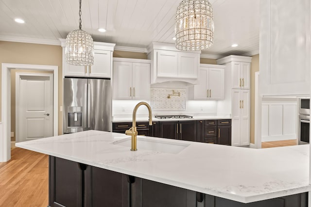 7 Nicklaus Way, Mashpee, MA 02649 - kitchen with a chandelier, stainless steel appliances, a sink, recessed lighting, and white cabinetry
