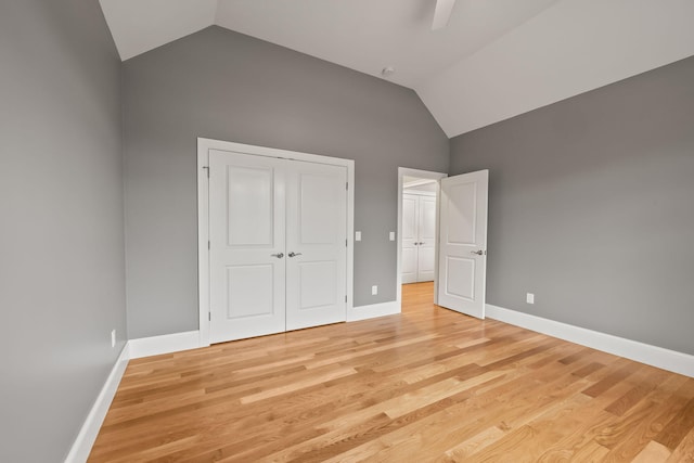 7 Nicklaus Way, Mashpee, MA 02649 - unfurnished bedroom with vaulted ceiling, light wood finished floors, baseboards, and a closet