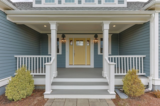 7 Nicklaus Way, Mashpee, MA 02649 - view of exterior entry with covered porch and roof with shingles
