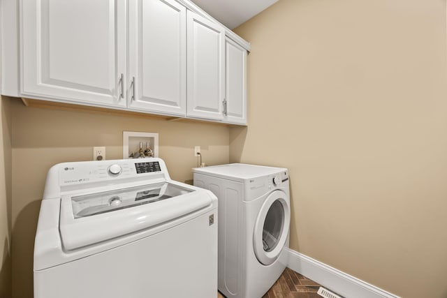 7 Nicklaus Way, Mashpee, MA 02649 - laundry area featuring washer and dryer, cabinet space, and baseboards