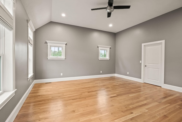 7 Nicklaus Way, Mashpee, MA 02649 - unfurnished bedroom with multiple windows, light wood finished floors, lofted ceiling, and recessed lighting