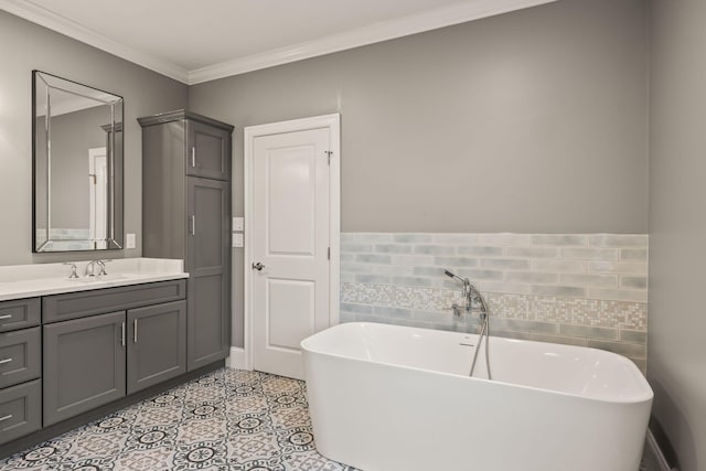 7 Nicklaus Way, Mashpee, MA 02649 - bathroom featuring a soaking tub, vanity, crown molding, and tile patterned floors