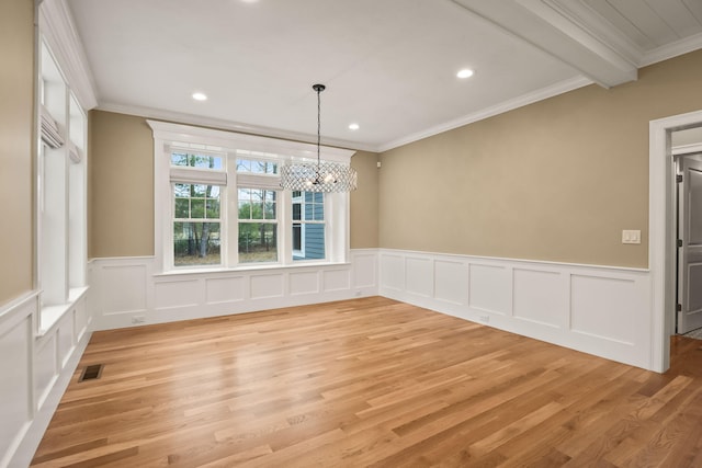 7 Nicklaus Way, Mashpee, MA 02649 - unfurnished dining area with crown molding, light wood finished floors, a chandelier, recessed lighting, and wainscoting