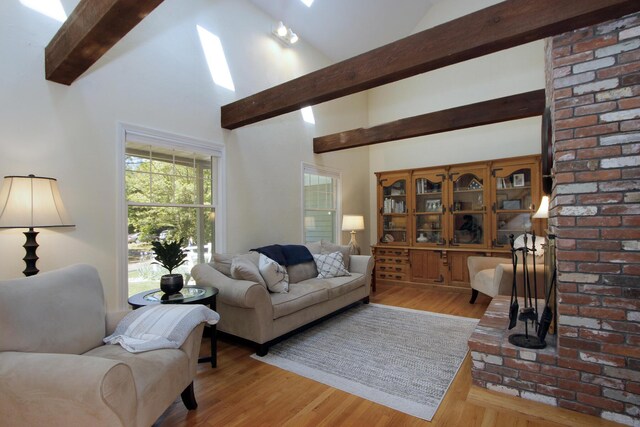 473 Thousand Oaks Dr, Brewster, MA 02631 - living room featuring beamed ceiling, wood finished floors, and high vaulted ceiling