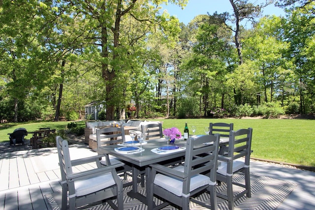 473 Thousand Oaks Dr, Brewster, MA 02631 - wooden deck featuring outdoor dining area, a lawn, and view of scattered trees