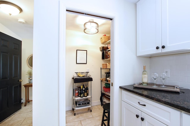 473 Thousand Oaks Dr, Brewster, MA 02631 - bar area featuring tasteful backsplash and light tile patterned flooring
