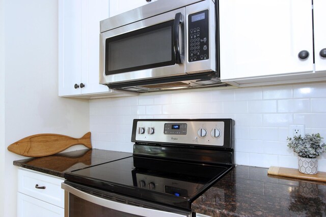 473 Thousand Oaks Dr, Brewster, MA 02631 - kitchen featuring stainless steel appliances, tasteful backsplash, white cabinetry, and dark stone countertops