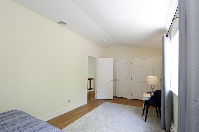 473 Thousand Oaks Dr, Brewster, MA 02631 - bedroom with vaulted ceiling, multiple closets, wood finished floors, and baseboards