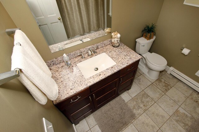 473 Thousand Oaks Dr, Brewster, MA 02631 - full bath featuring toilet, vanity, tile patterned flooring, a baseboard heating unit, and baseboards
