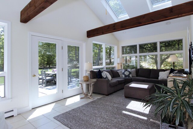 473 Thousand Oaks Dr, Brewster, MA 02631 - living area with a skylight, tile patterned floors, plenty of natural light, beam ceiling, and high vaulted ceiling