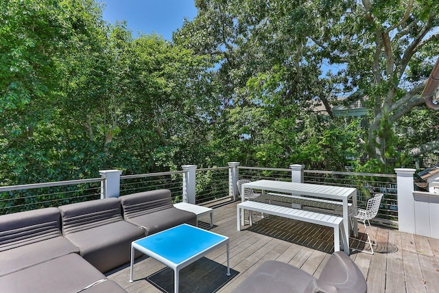 wooden terrace with an outdoor hangout area