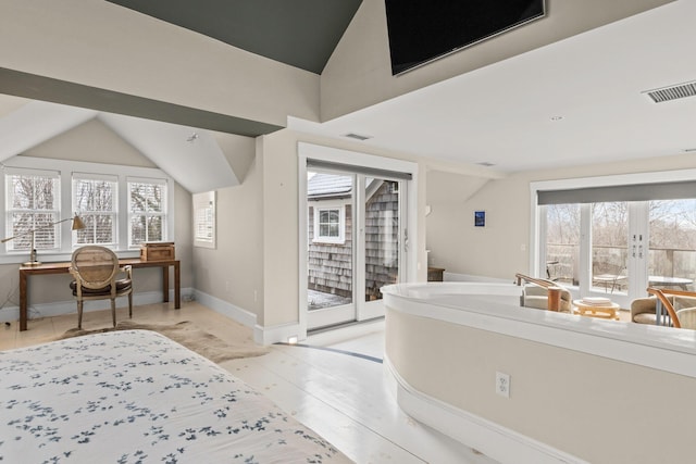 bedroom with french doors, access to outside, and lofted ceiling