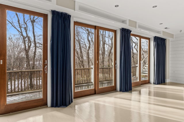 doorway featuring wood walls
