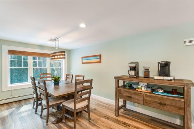 dining area featuring visible vents, baseboards, light wood-style flooring, recessed lighting, and a baseboard heating unit