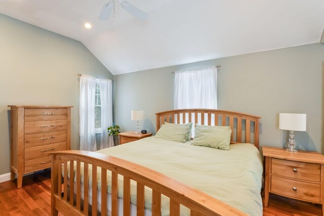 bedroom featuring vaulted ceiling, wood finished floors, and ceiling fan