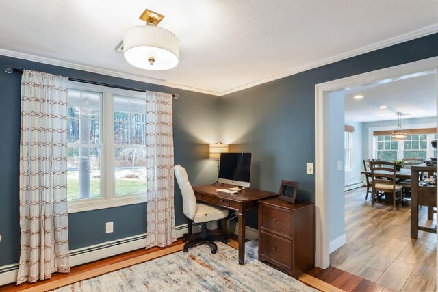 office featuring ornamental molding, a baseboard heating unit, wood finished floors, baseboards, and baseboard heating