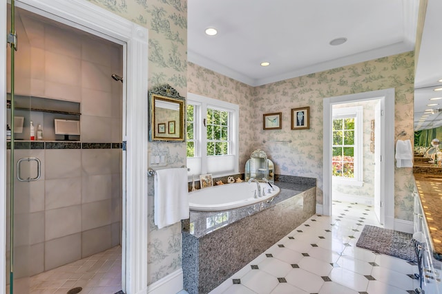 bathroom with a wealth of natural light and separate shower and tub