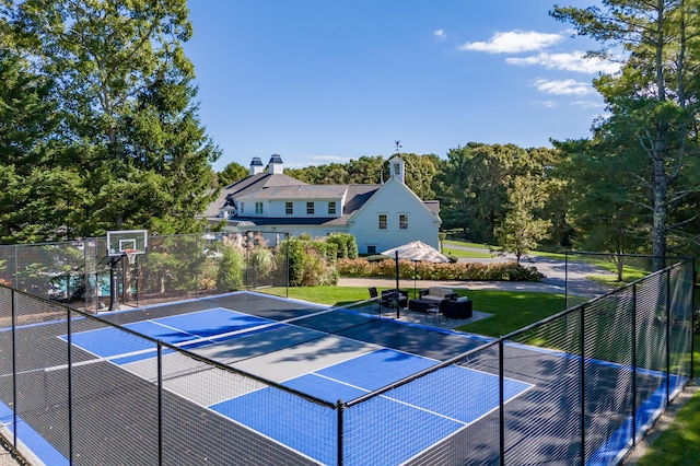 view of basketball court featuring tennis court