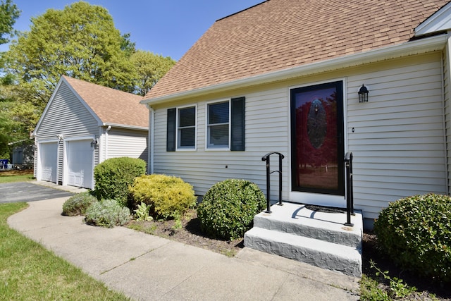 8 Great Rock Rd, Bourne, MA 02532 - entrance to property featuring roof with shingles and a garage