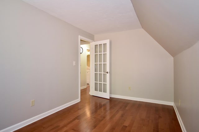 8 Great Rock Rd, Bourne, MA 02532 - additional living space with wood finished floors, vaulted ceiling, and baseboards