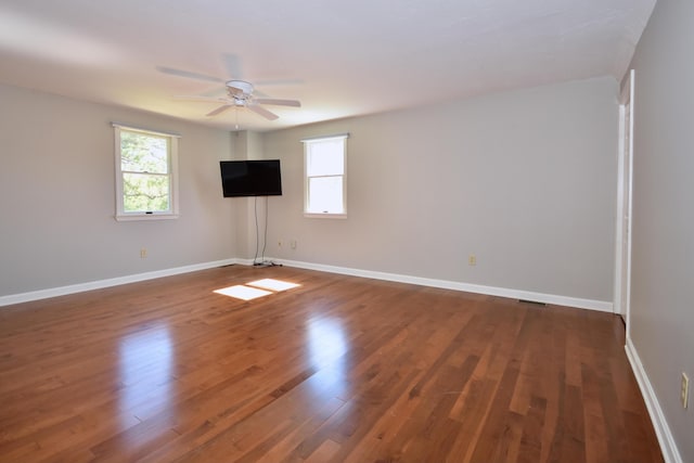 8 Great Rock Rd, Bourne, MA 02532 - unfurnished room with a ceiling fan, wood finished floors, and baseboards
