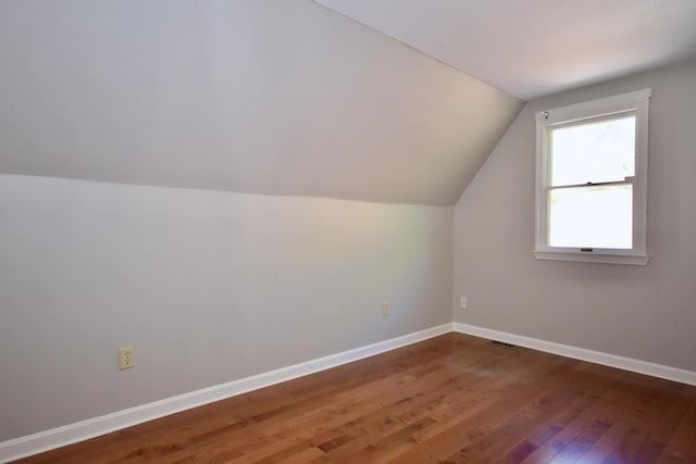 8 Great Rock Rd, Bourne, MA 02532 - additional living space featuring wood-type flooring, vaulted ceiling, and baseboards