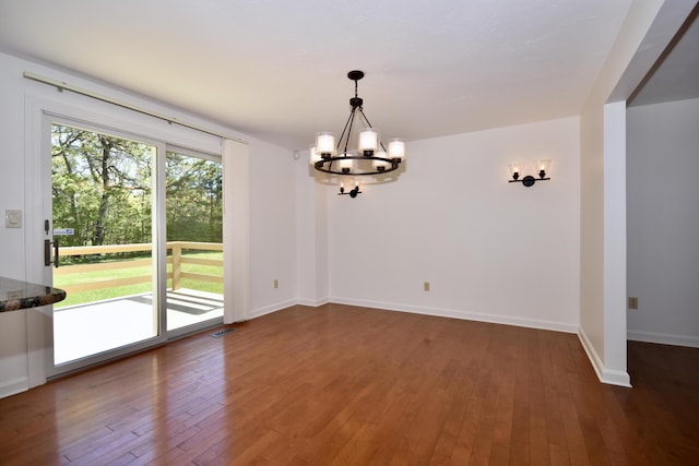 8 Great Rock Rd, Bourne, MA 02532 - unfurnished dining area featuring a chandelier, wood finished floors, and baseboards