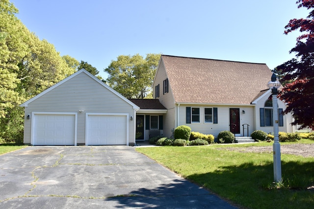 8 Great Rock Rd, Bourne, MA 02532 - cape cod home featuring roof with shingles, driveway, an attached garage, and a front lawn