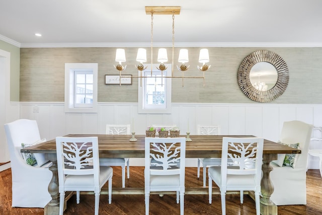 dining room with hardwood / wood-style floors and ornamental molding