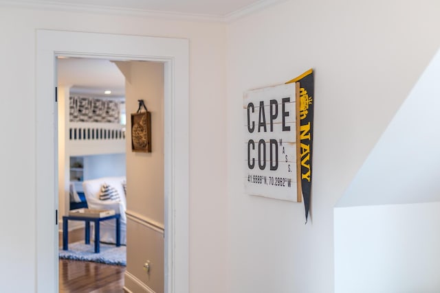 interior details featuring crown molding and wood-type flooring