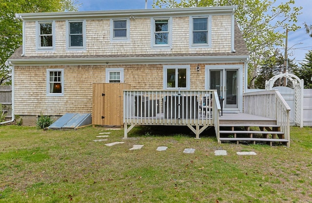 77 Center St, Dennis Port, MA 02639 - rear view of property with a yard and a wooden deck