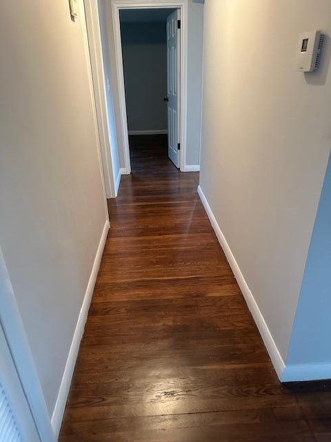 86 Seabrook Rd, Hyannis, MA 02601 - corridor with baseboards and dark wood-type flooring