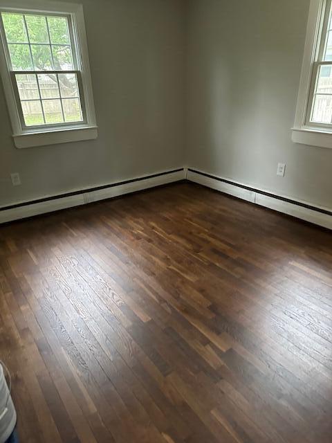 86 Seabrook Rd, Hyannis, MA 02601 - empty room with dark wood-type flooring