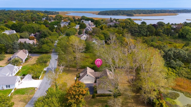 bird's eye view with a residential view, a water view, and a forest view