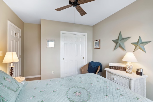 bedroom with a ceiling fan, carpet, a closet, and baseboards