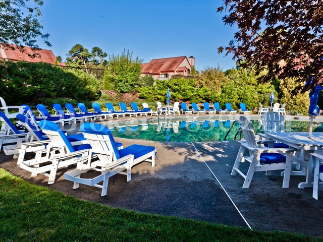 community pool with a patio